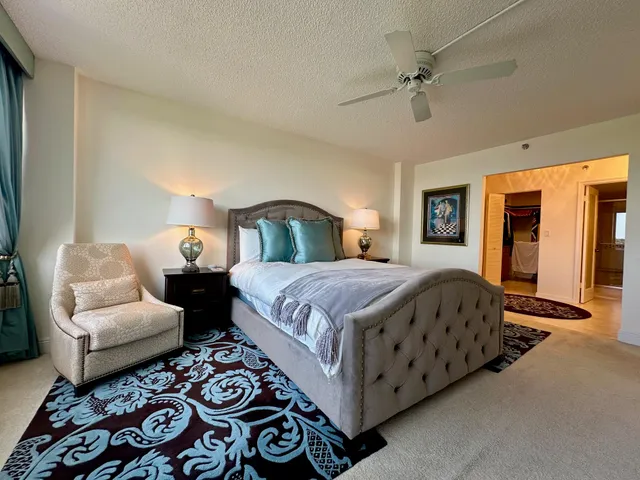 a spacious bedroom with a bed and a couch