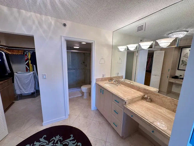 a bathroom with a sink a double vanity and a mirror