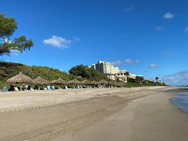 a view of a road with a snow in the background