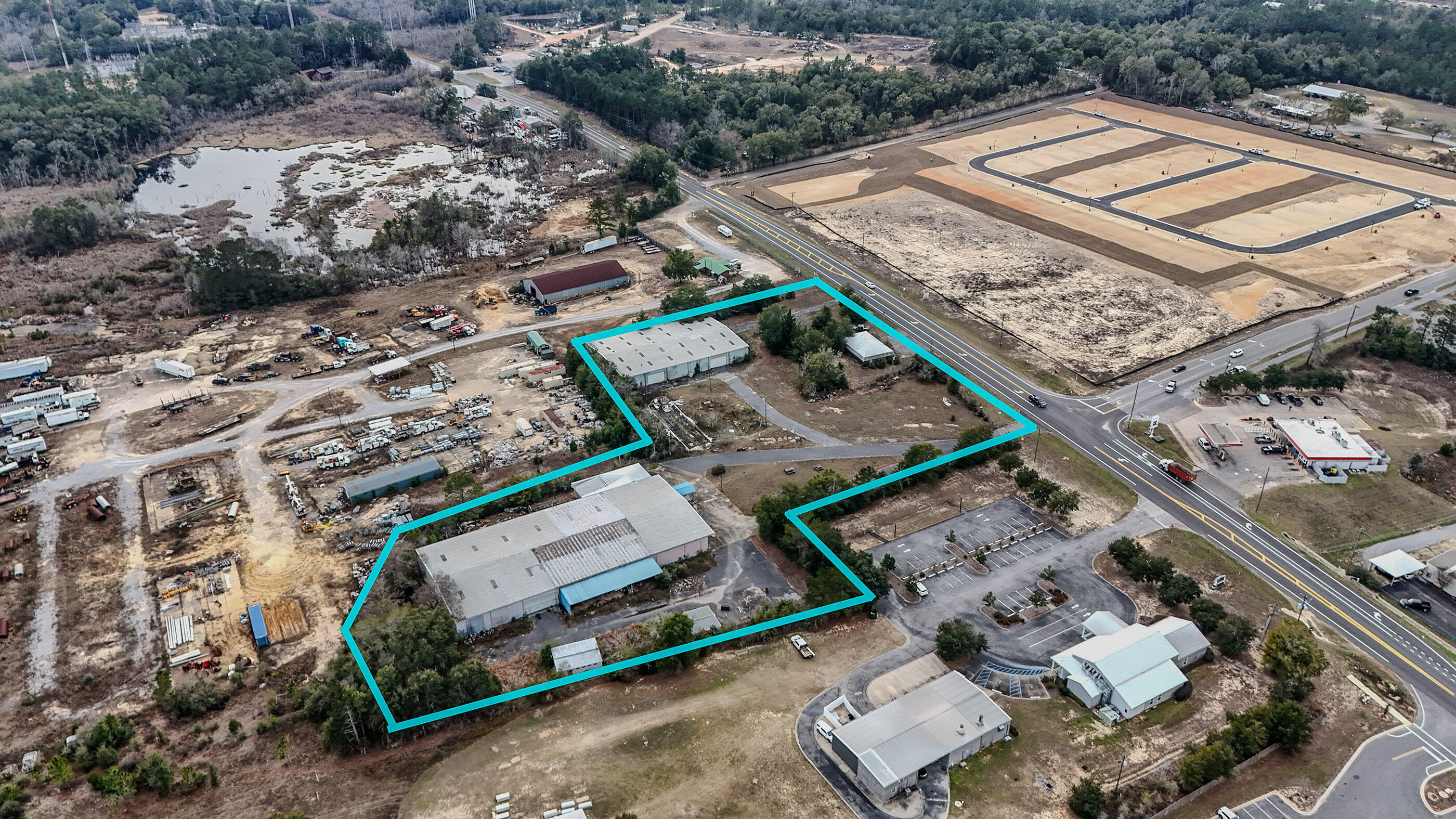 1408 Highway 83 DeFuniak Springs, FL 32433 - Photo 1 of 8 an aerial view of a residential building with an outdoor space
