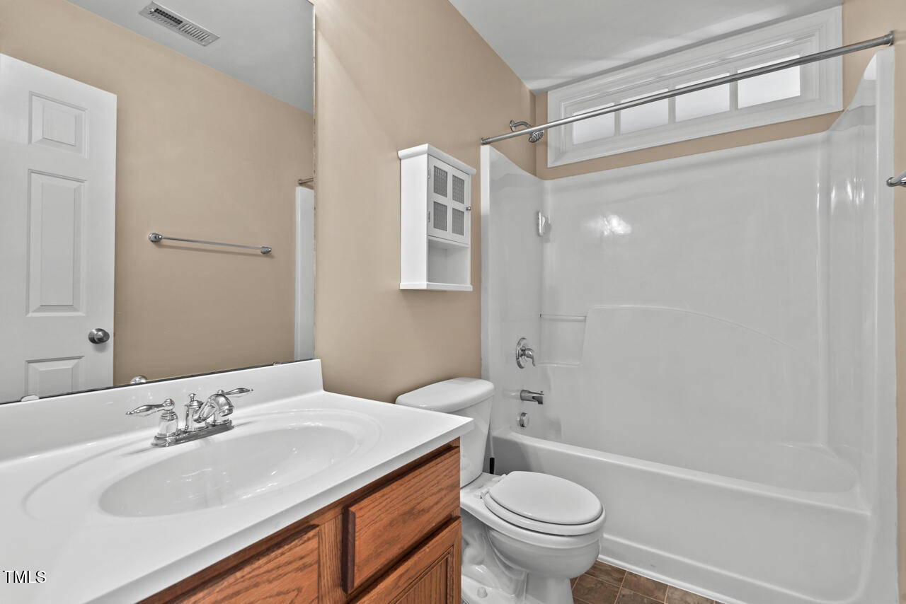 6116 Tiffield Way Wake Forest, NC 27587 - Photo 30 of 39 a bathroom with a sink toilet and shower