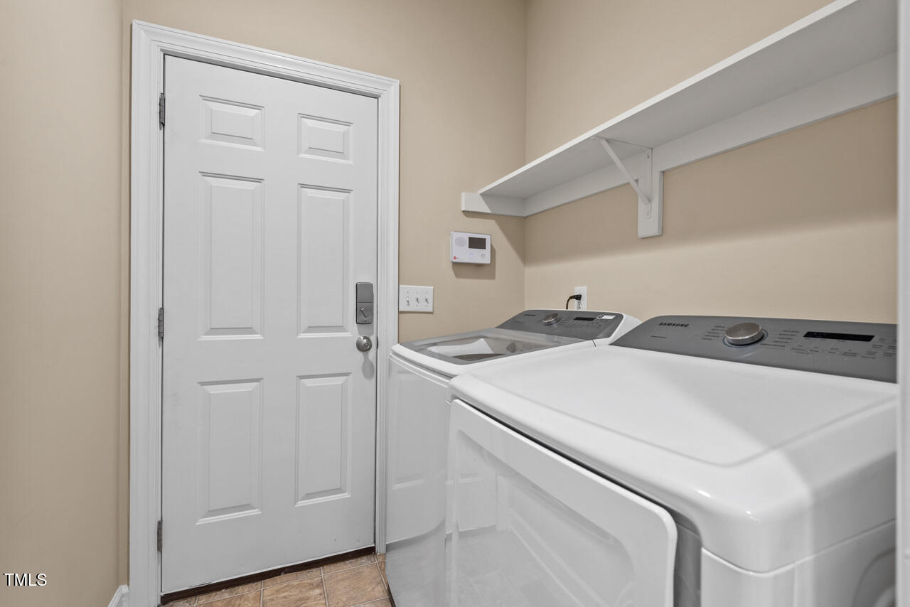 6116 Tiffield Way Wake Forest, NC 27587 - Photo 31 of 39 a utility room with dryer and washer