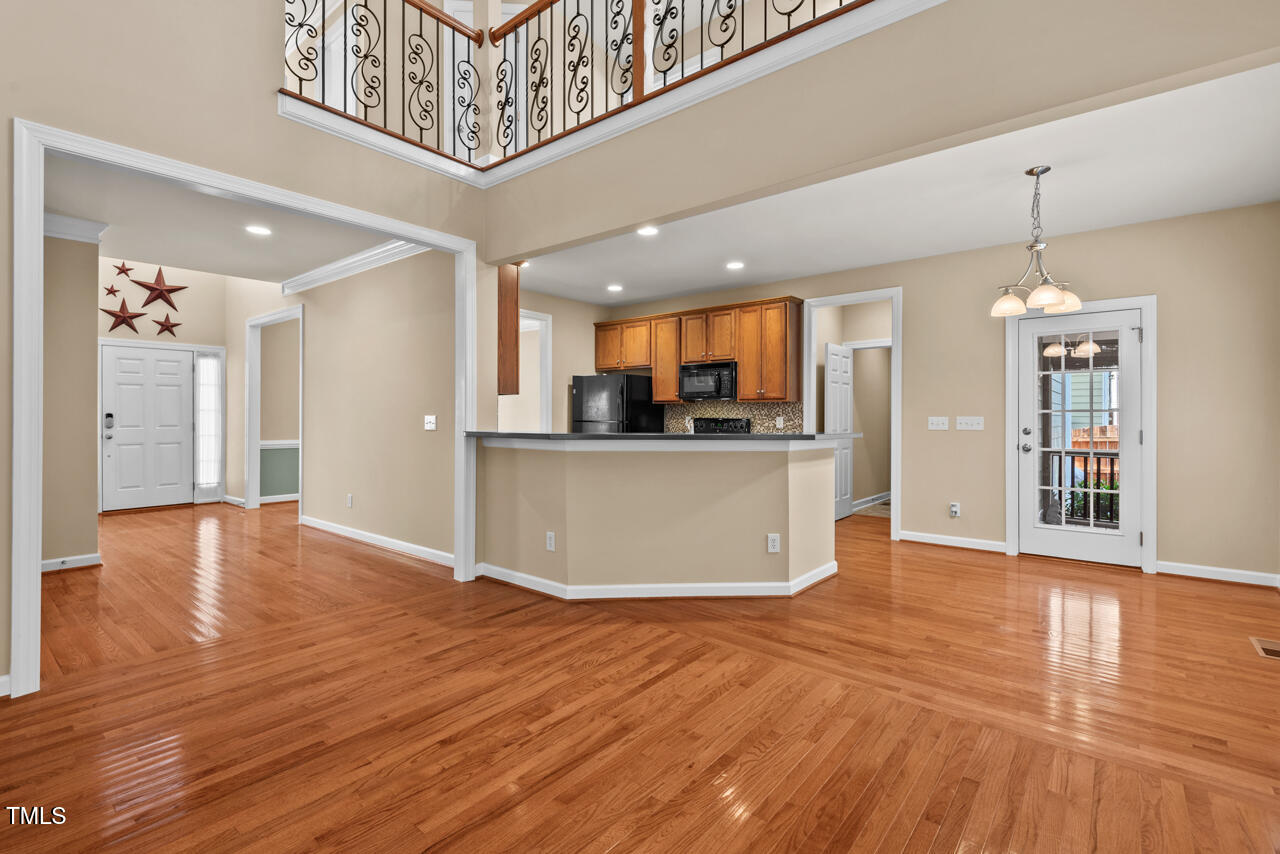 6116 Tiffield Way Wake Forest, NC 27587 - Photo 10 of 39 a view of a kitchen with furniture and wooden floor