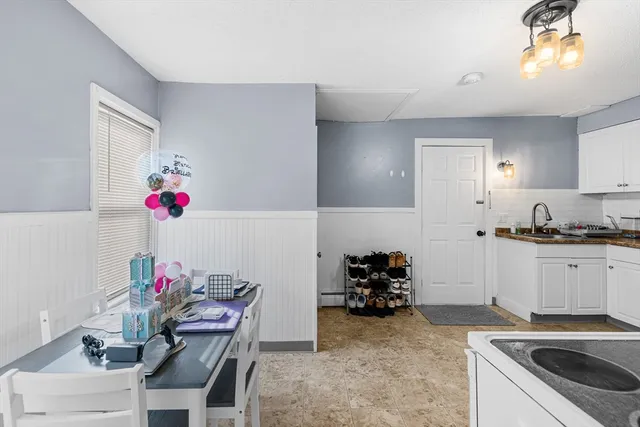 a kitchen with a sink and cabinets