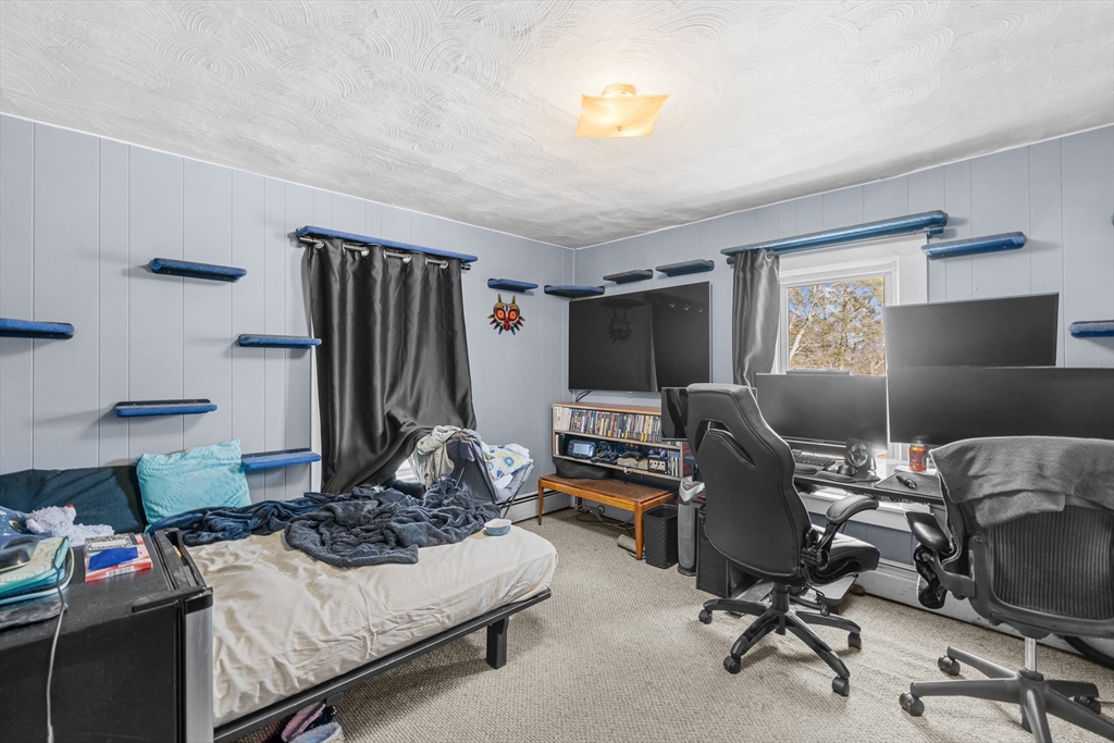 58 Read Avenue Coventry, RI 02816 - Photo 28 of 36 a living room with furniture and a flat screen tv