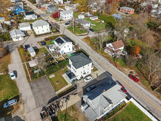 an aerial view of a house with a ocean view