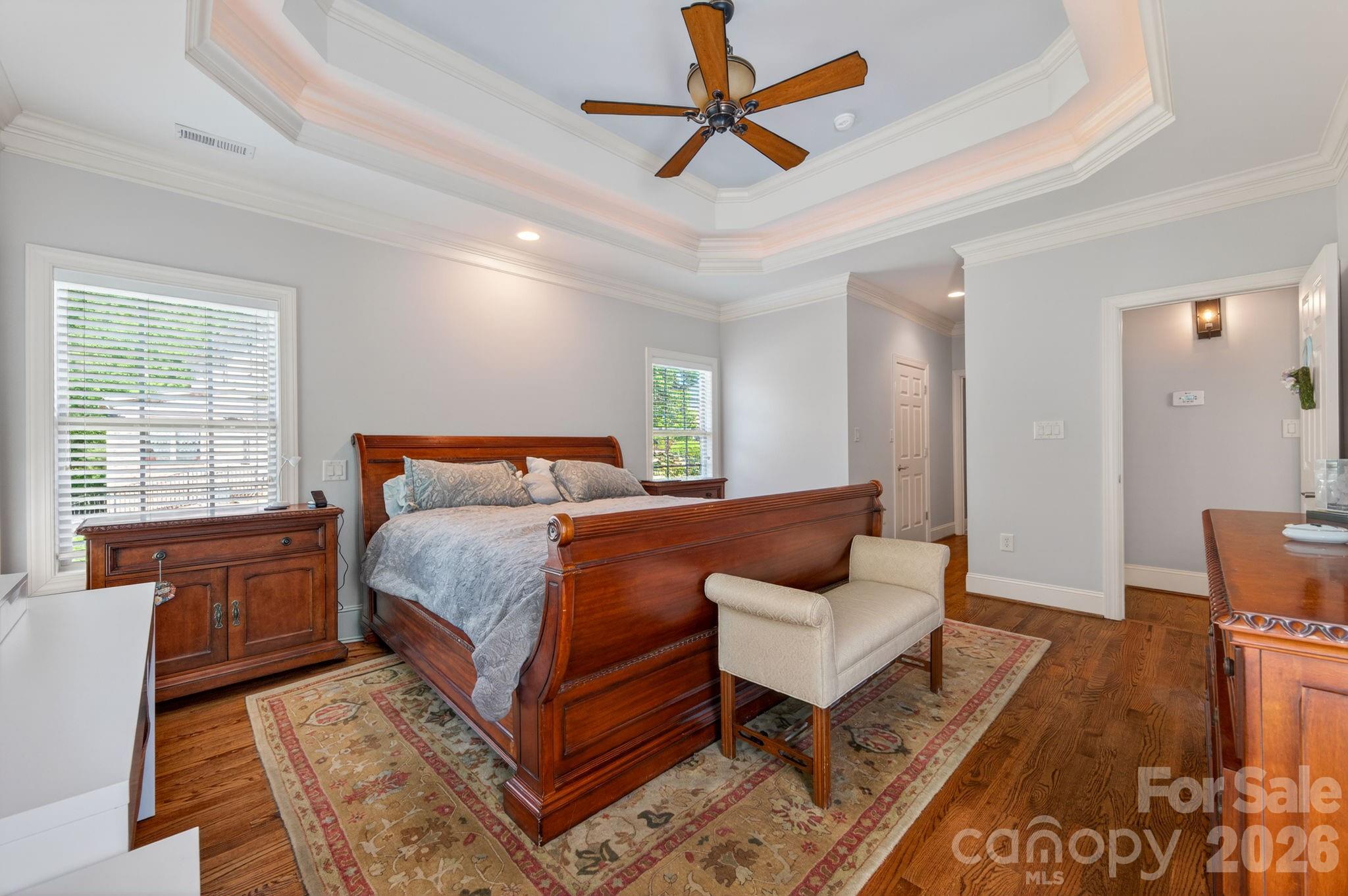 3138 Rappahannock Court, Unit 16 Matthews, NC 28104 - Photo 37 of 38 a bedroom with a bed rug and wooden floor