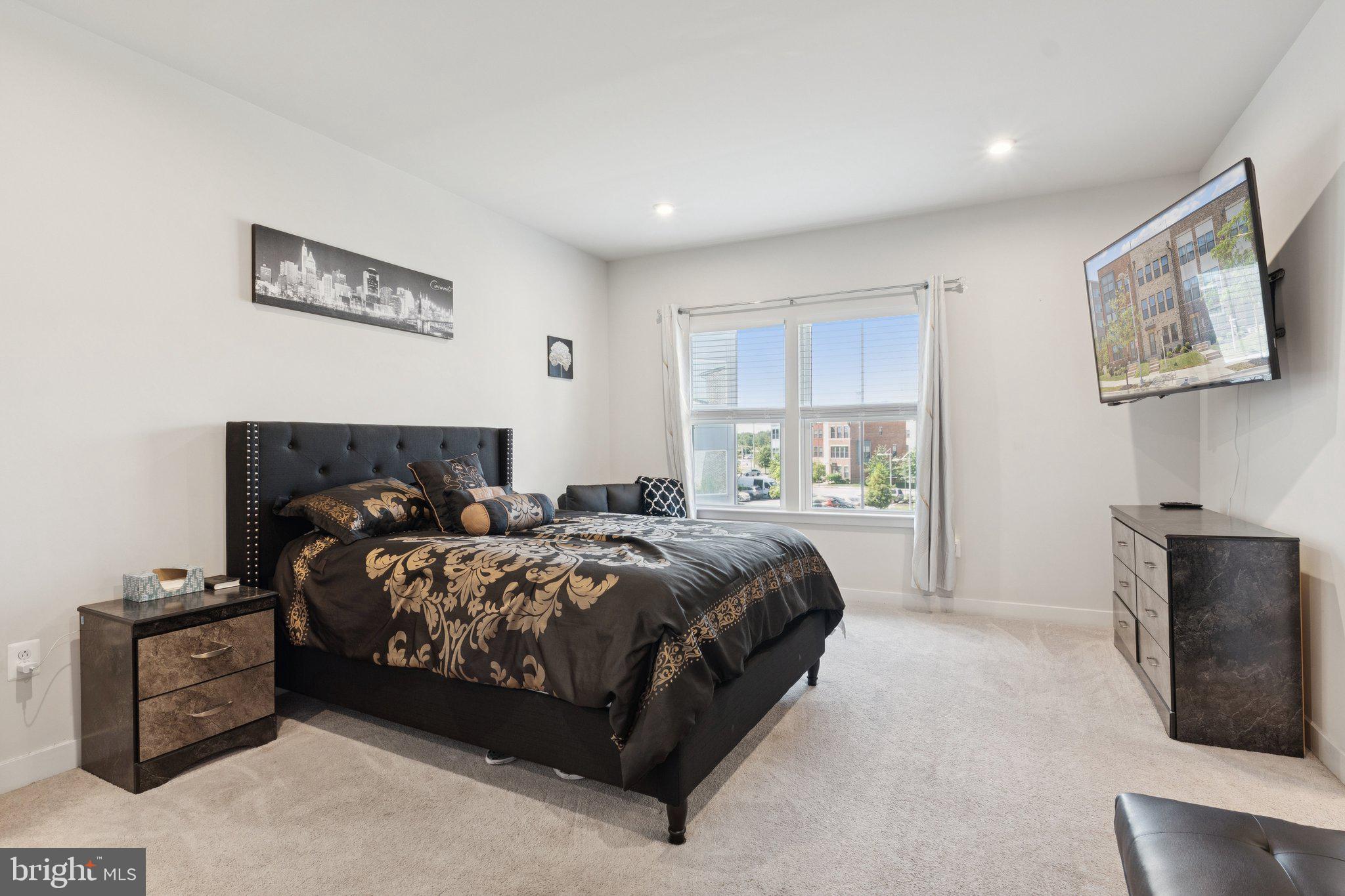 2823 Toles Park Drive Suitland, MD 20746 - Photo 18 of 46 a bed room with a bed and a television