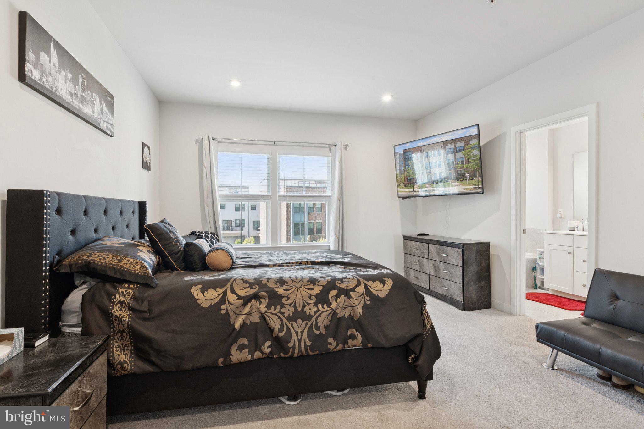 2823 Toles Park Drive Suitland, MD 20746 - Photo 19 of 46 a bedroom with bed couch and window