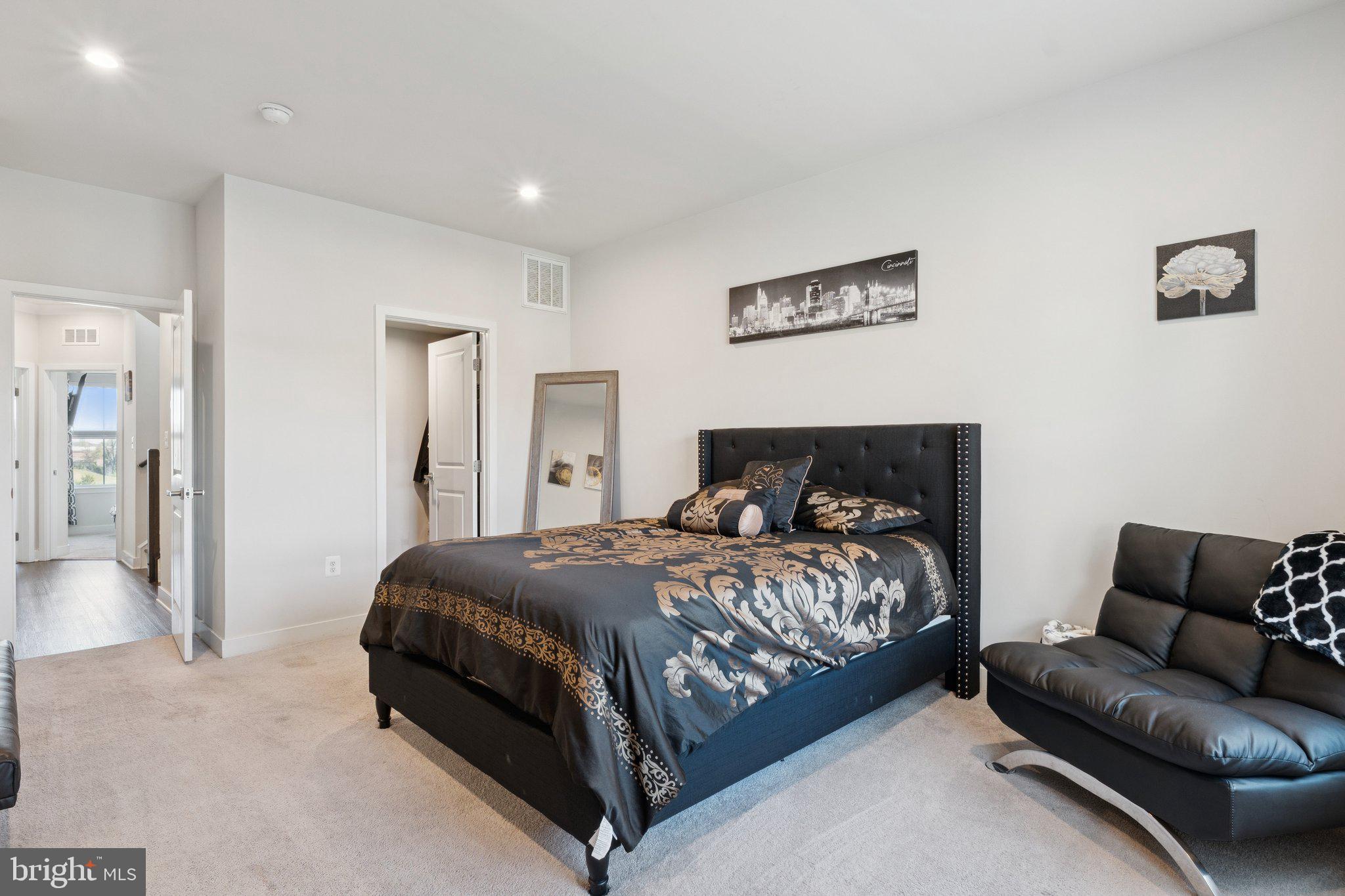 2823 Toles Park Drive Suitland, MD 20746 - Photo 20 of 46 a bedroom with a bed couch and a couch