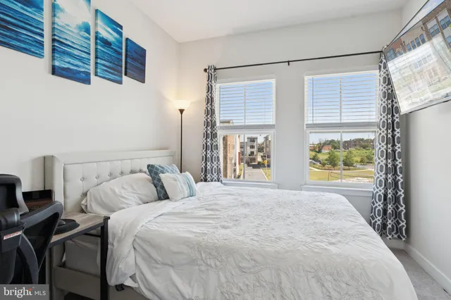 a view of a livingroom with furniture and a wooden floor