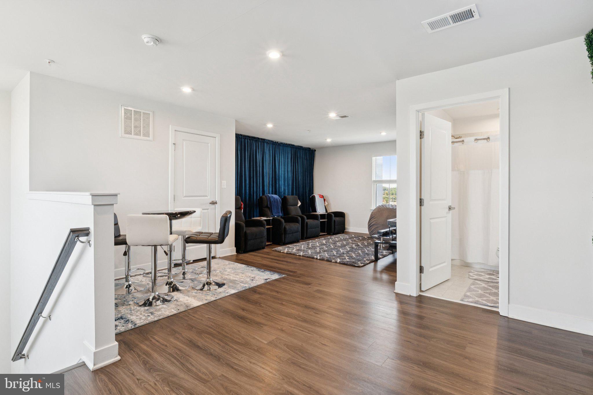 2823 Toles Park Drive Suitland, MD 20746 - Photo 25 of 46 a view of a livingroom with furniture and a wooden floor