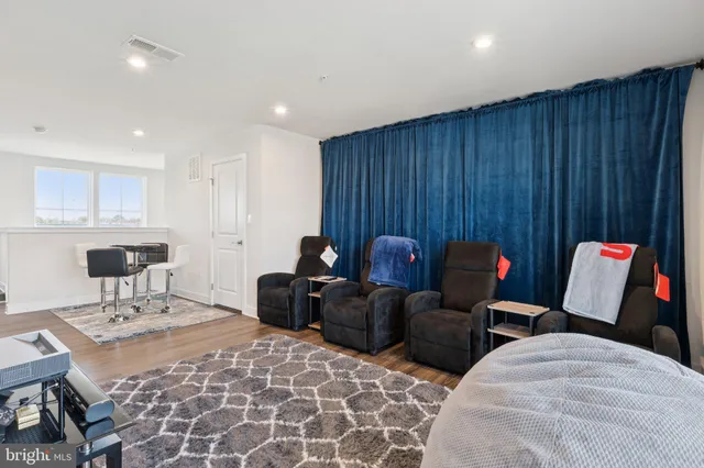 a living room with furniture and a table