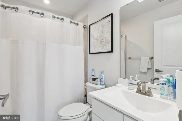 a roof deck with table and chairs