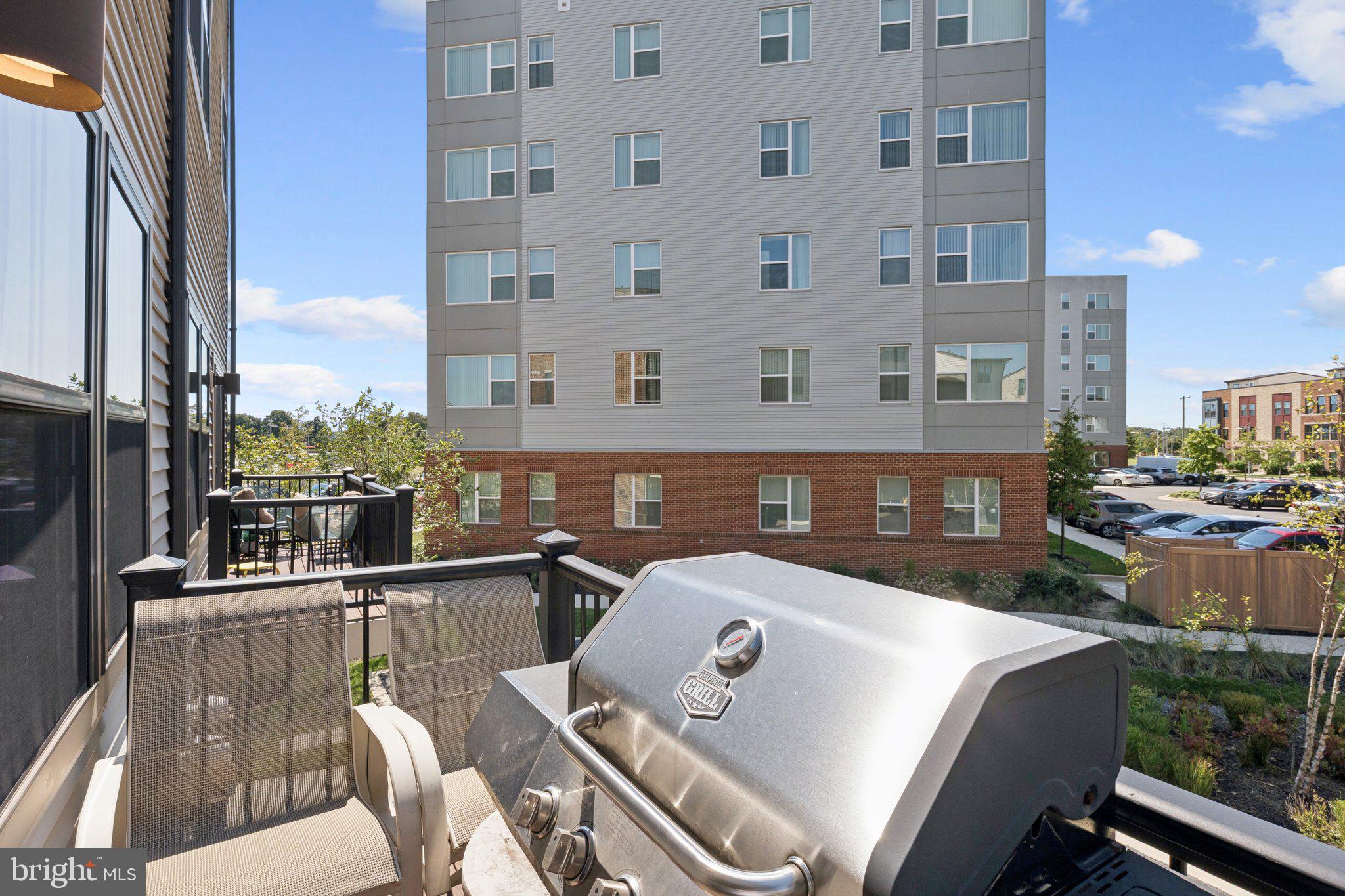 2823 Toles Park Drive Suitland, MD 20746 - Photo 36 of 46 a view of a balcony with two chairs and a table