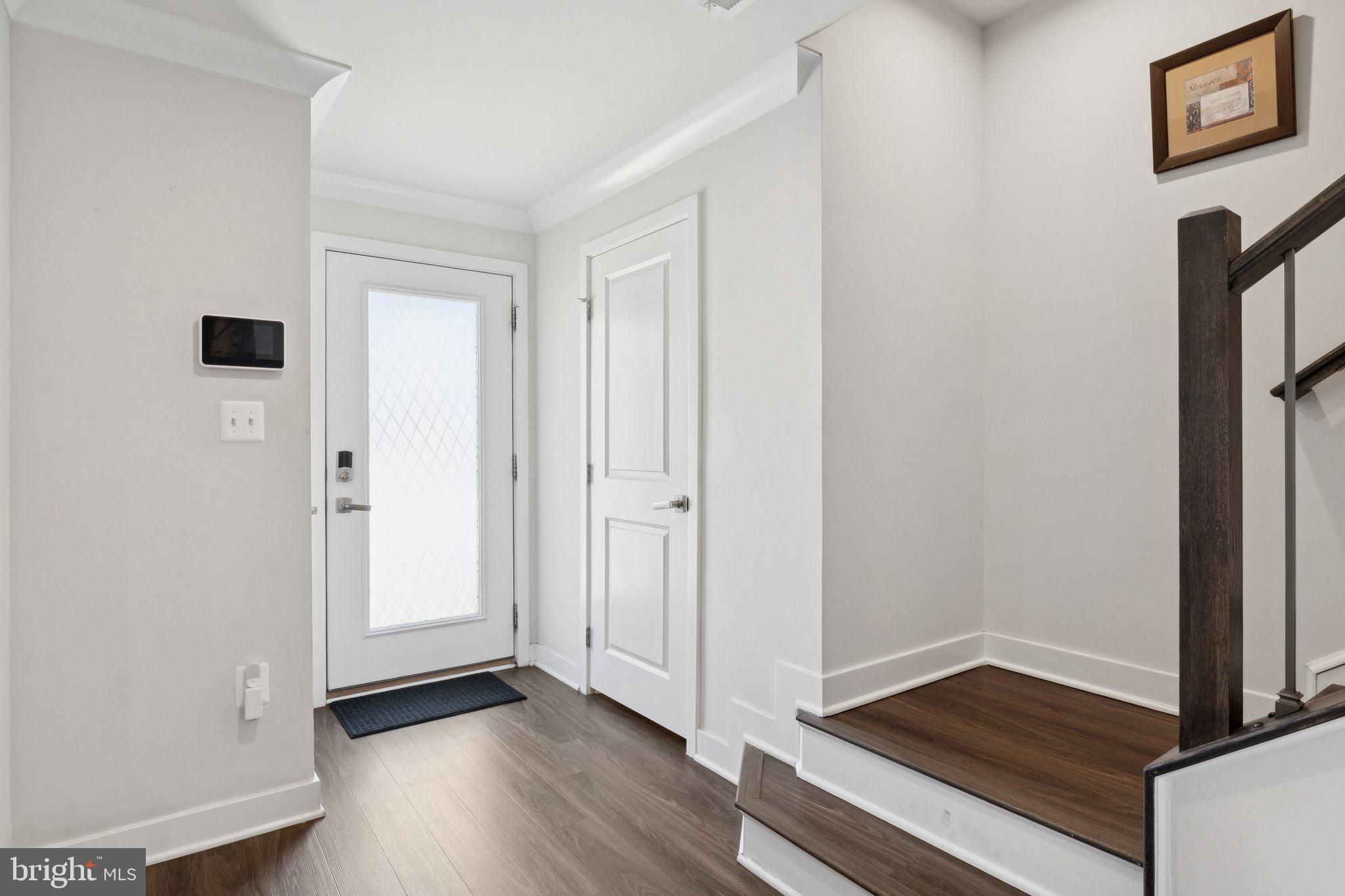 2823 Toles Park Drive Suitland, MD 20746 - Photo 4 of 46 a view of an empty room with wooden floor and a window