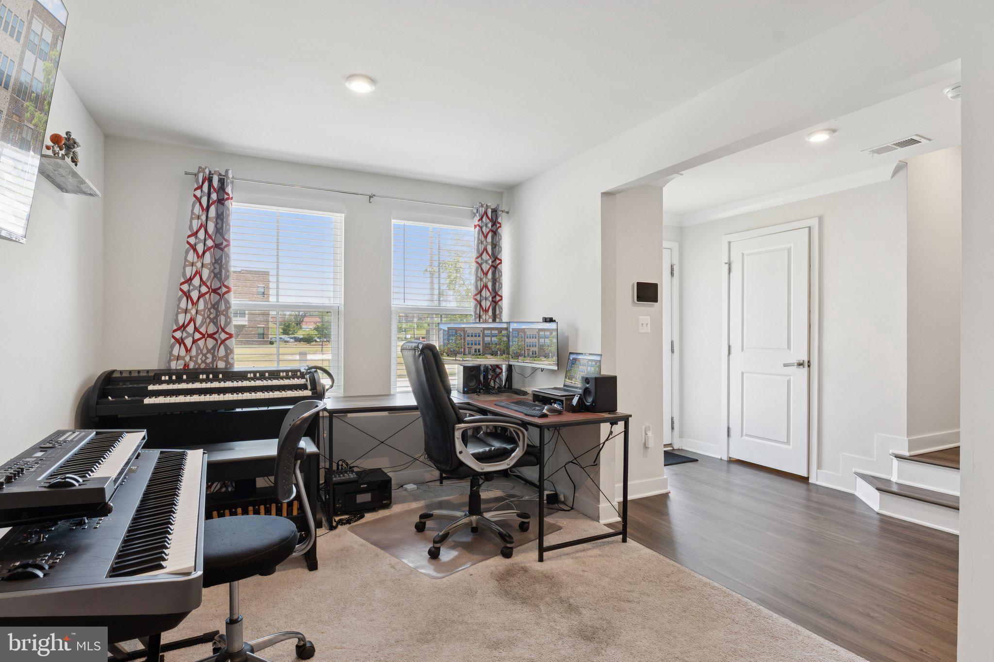 2823 Toles Park Drive Suitland, MD 20746 - Photo 5 of 46 a view of a workspace with furniture and a window