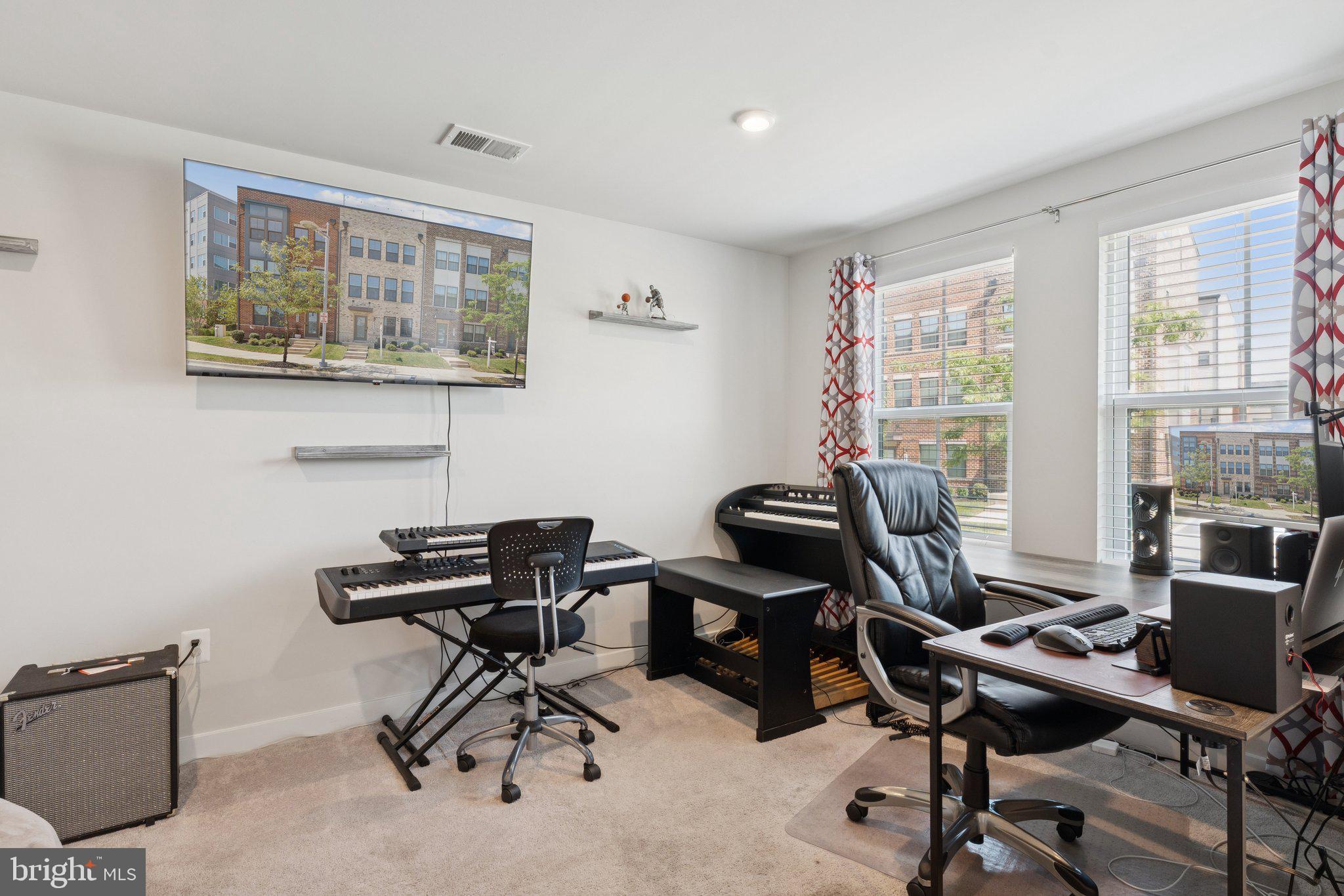2823 Toles Park Drive Suitland, MD 20746 - Photo 6 of 46 a view of a workspace with furniture and a window