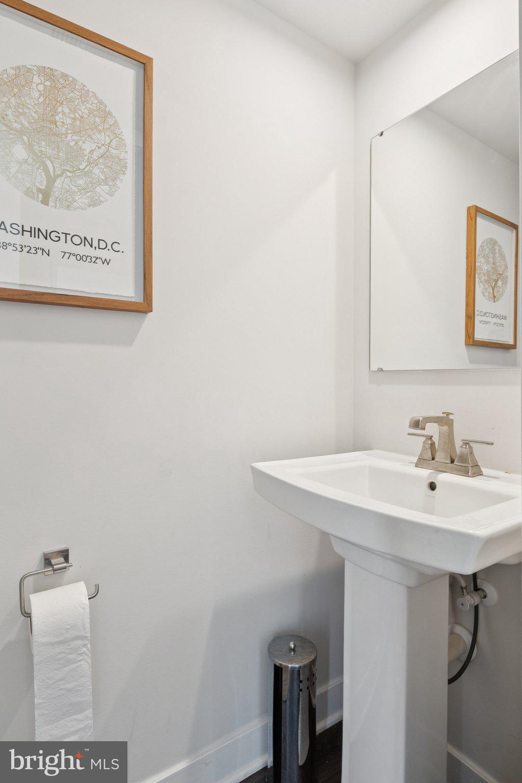 2823 Toles Park Drive Suitland, MD 20746 - Photo 7 of 46 a bathroom with a sink a toilet and a mirror