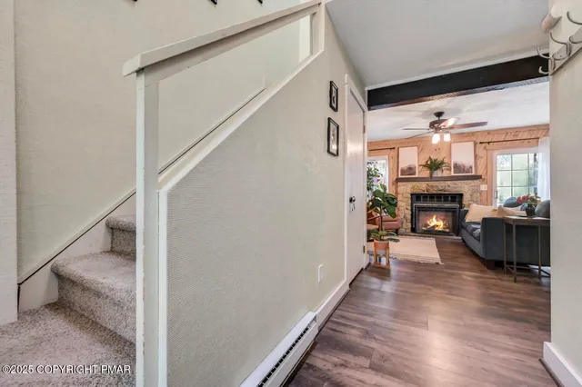 a view of a livingroom with furniture window and wooden floor
