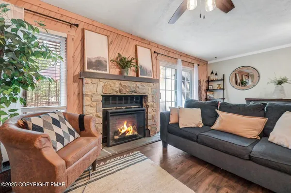 a living room with furniture and a flat screen tv