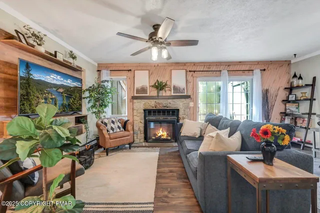 a living room with furniture and a fireplace