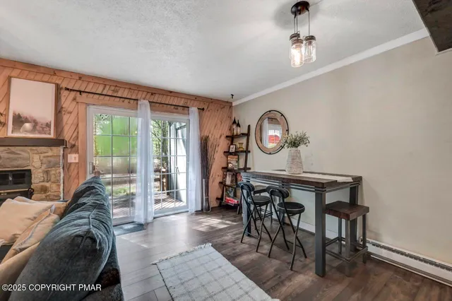 a spacious bedroom with two beds and a fireplace