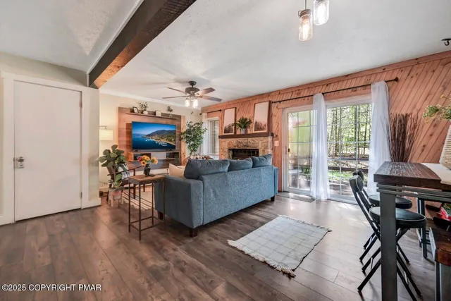 a view of a house with a yard and sitting area
