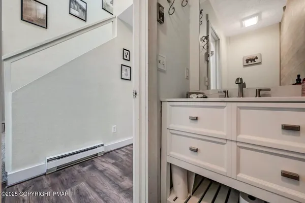 a spacious bedroom with two beds and a fireplace