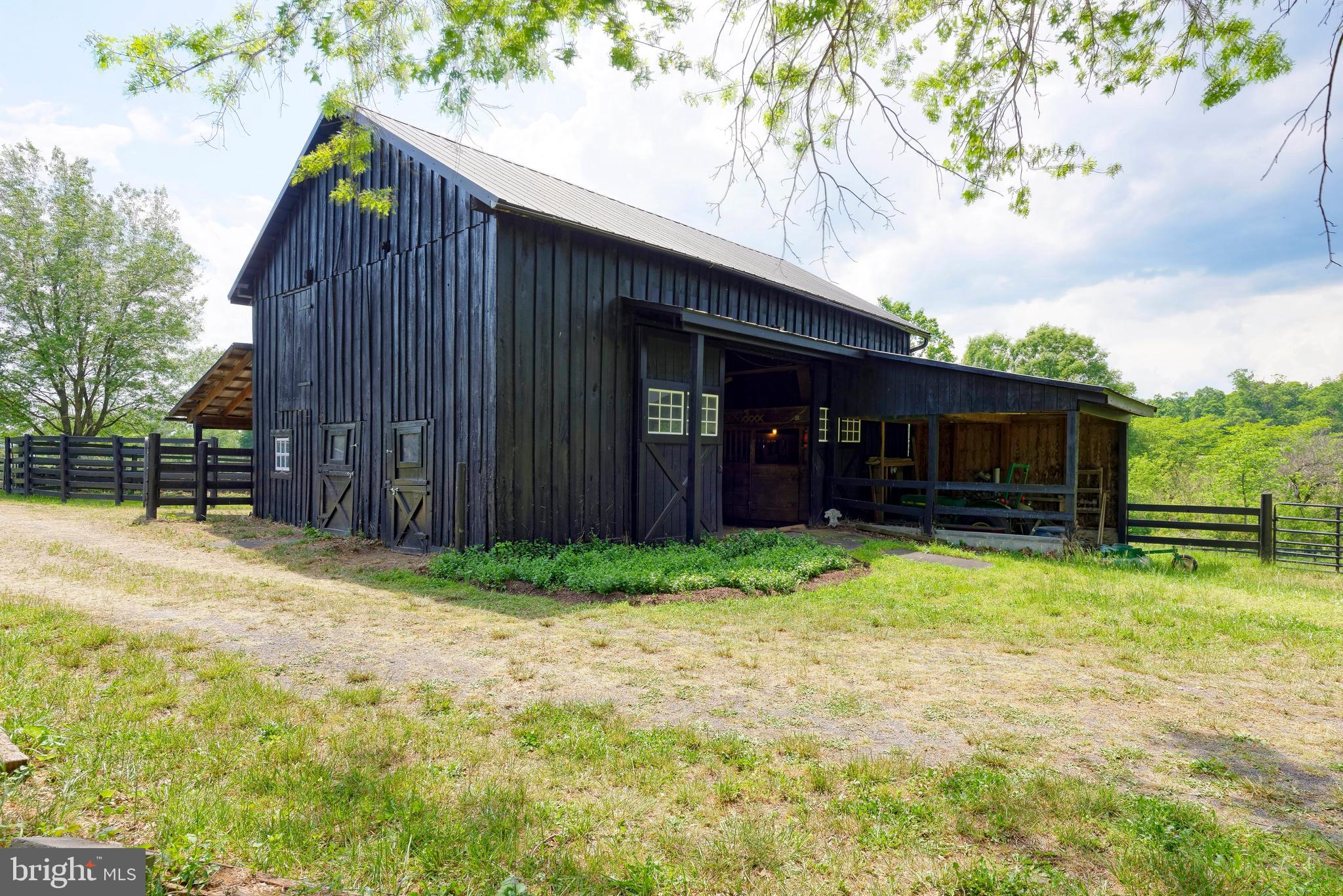 33195 Millville Road Upperville, VA 20184 - Photo 50 of 76 Front of barn has covered area for a tractor