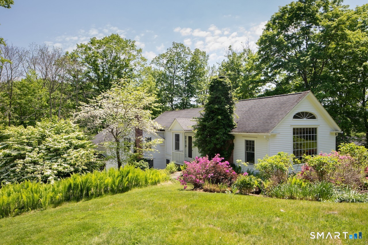 329 Housatonic River Road Salisbury, CT 06031 - Photo 30 of 32 a front view of a house with a yard and garage
