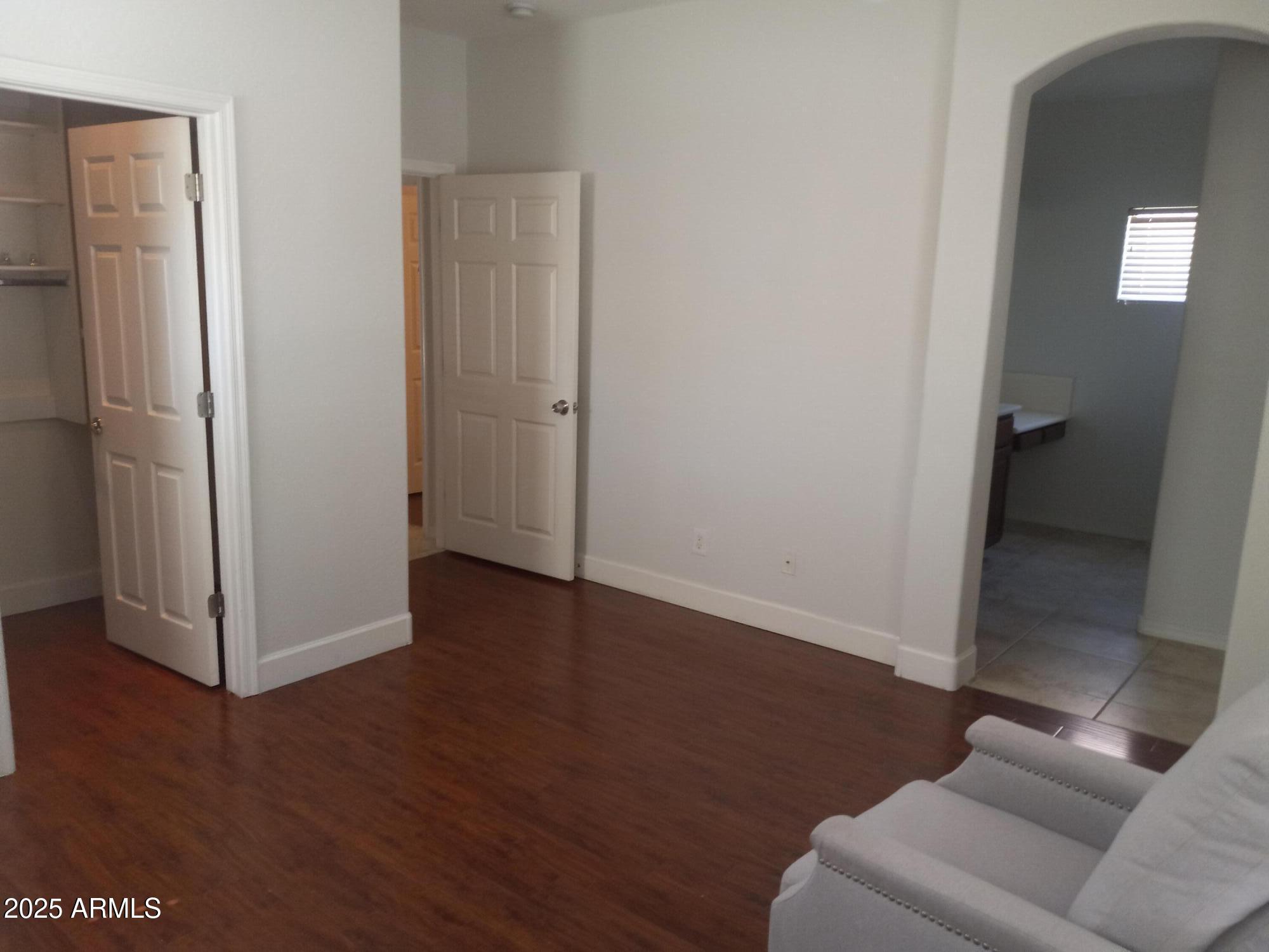 3947 West Roundabout Circle Chandler, AZ 85226 - Photo 22 of 32 a view of livingroom with furniture and wooden floor