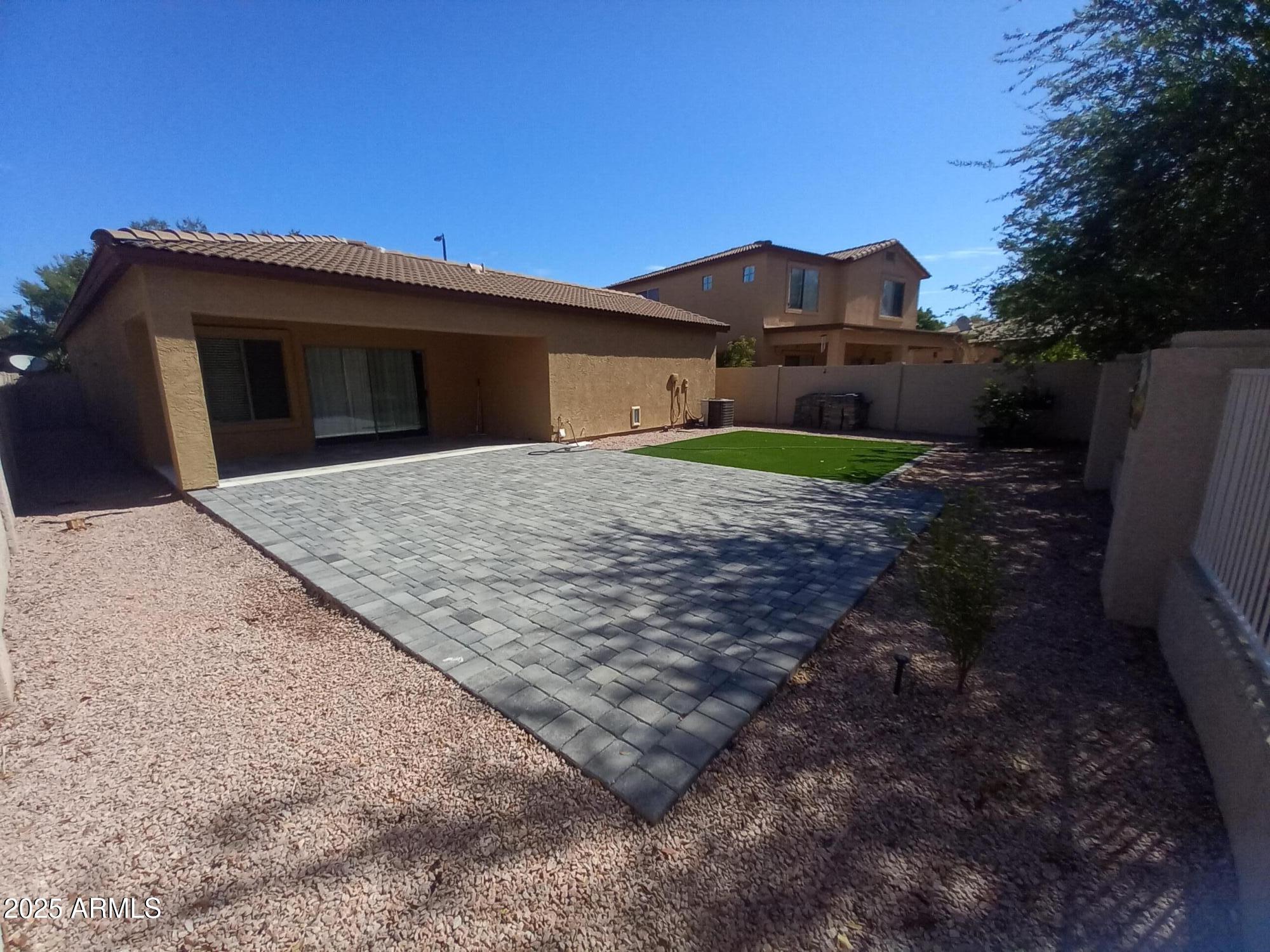 3947 West Roundabout Circle Chandler, AZ 85226 - Photo 27 of 32 a view of a house with a yard