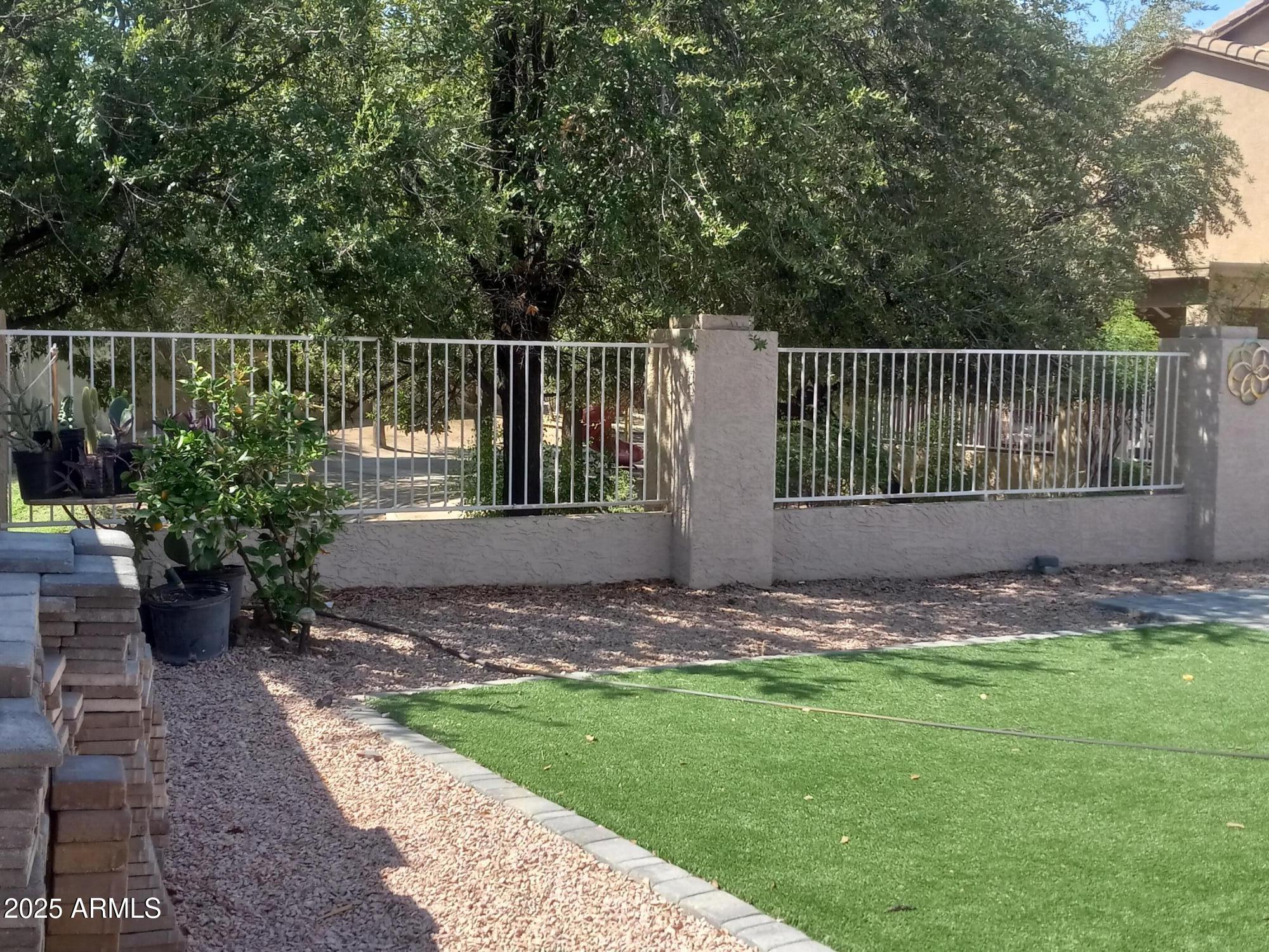 3947 West Roundabout Circle Chandler, AZ 85226 - Photo 31 of 32 a view of a backyard with a garden