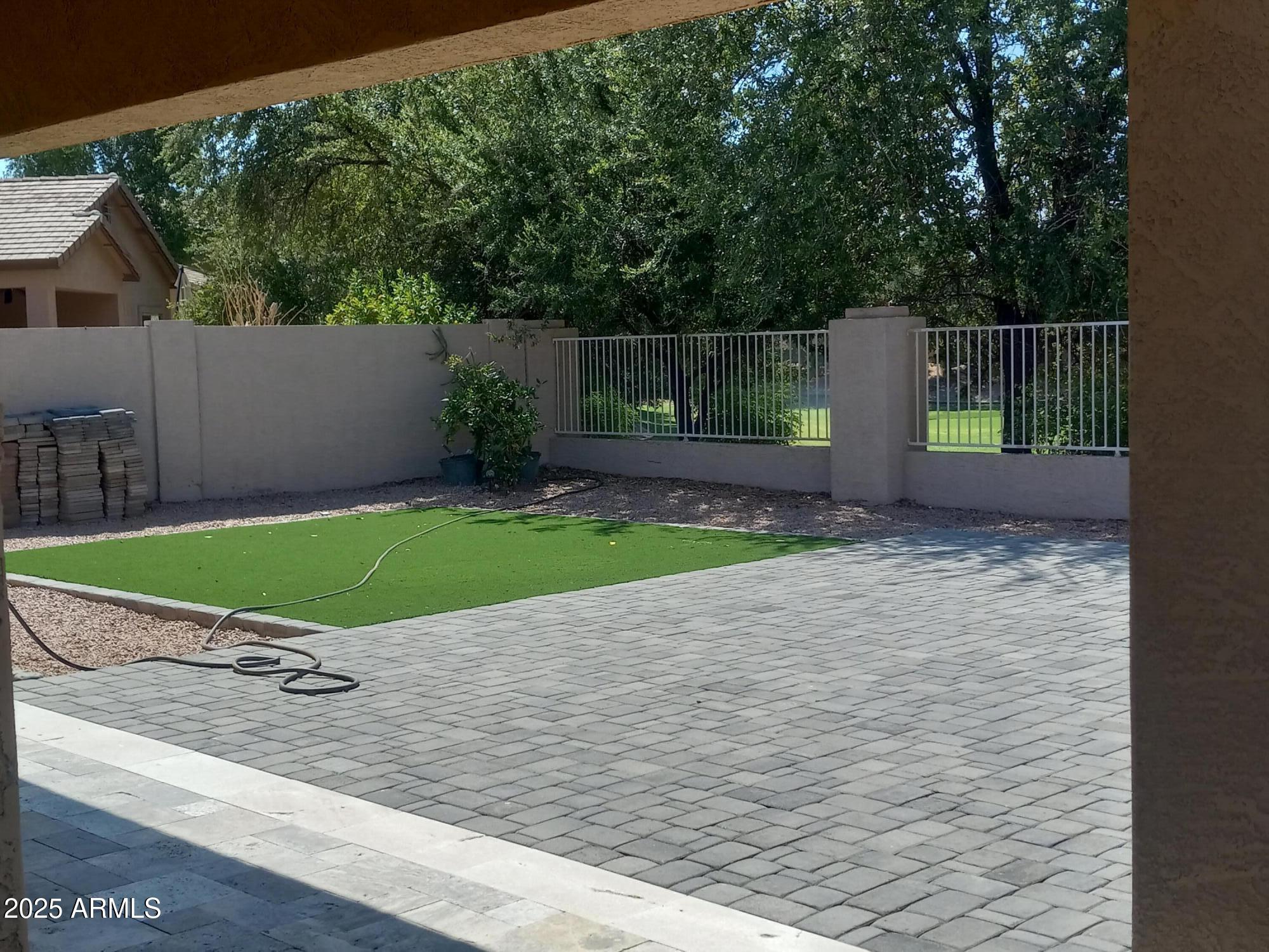 3947 West Roundabout Circle Chandler, AZ 85226 - Photo 32 of 32 a view of a small space with wooden fence