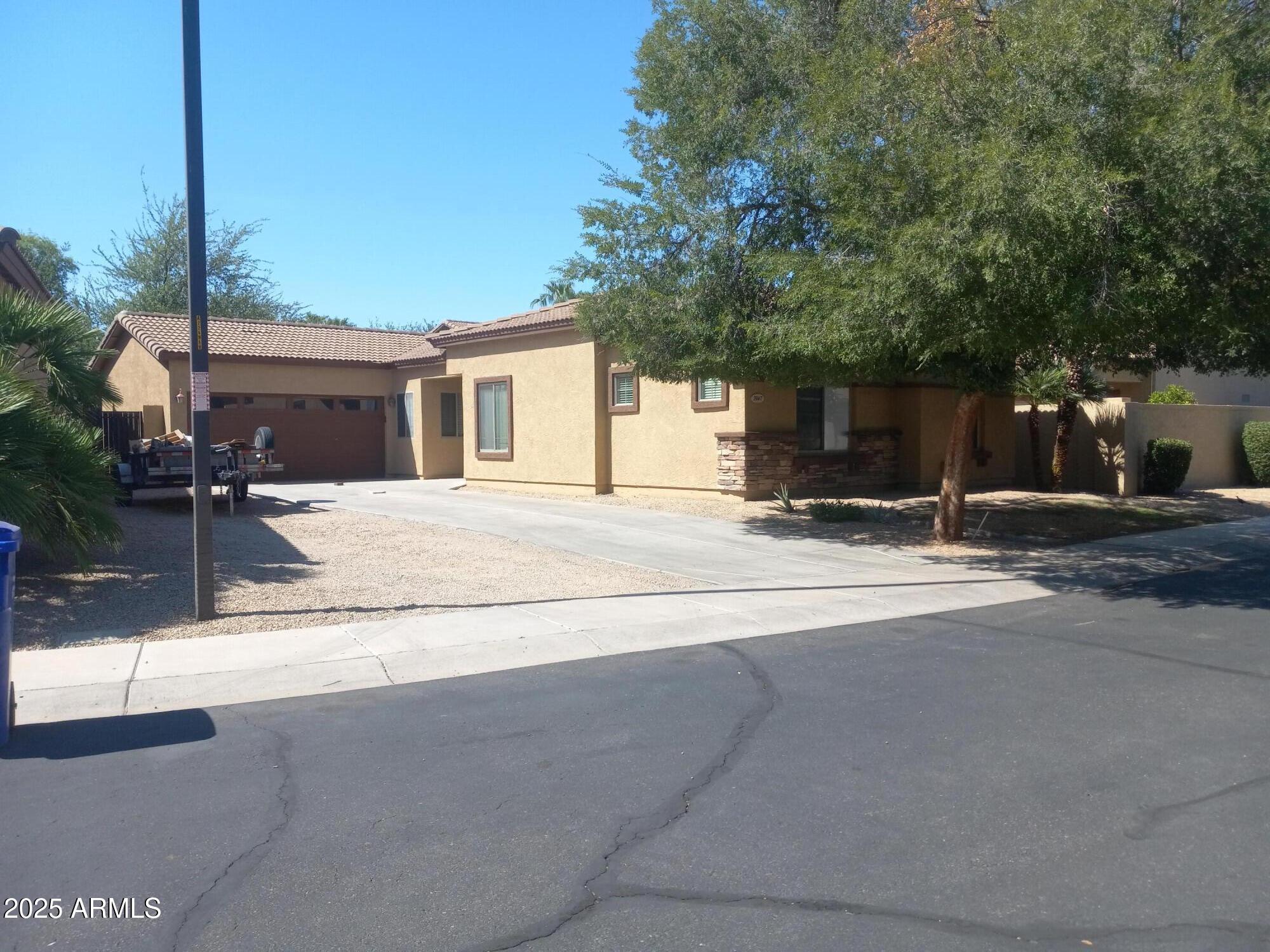 3947 West Roundabout Circle Chandler, AZ 85226 - Photo 4 of 32 a view of a house with a outdoor space