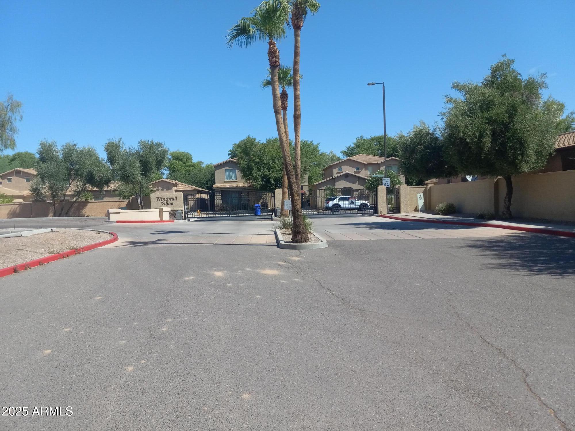 3947 West Roundabout Circle Chandler, AZ 85226 - Photo 6 of 32 a view of a street with houses