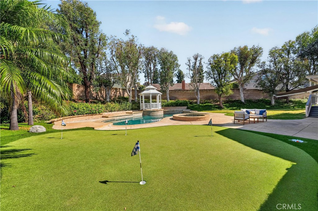 2935 Bluebell Avenue Brea, CA 92821 - Photo 33 of 38 Resort-style backyard featuring a pool, spa, putting green, spacious patio, and gazebo, perfect for entertaining and relaxing