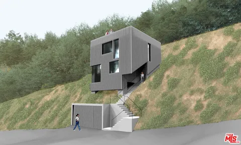 a view of a house with a small yard