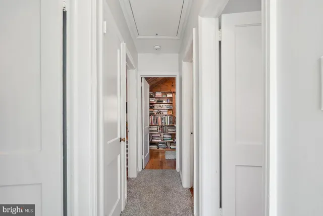 a dining room with furniture and a chandelier