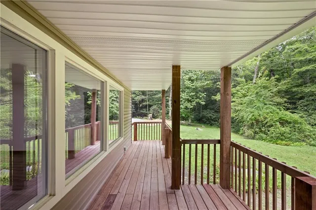 a view of a room with wooden floor