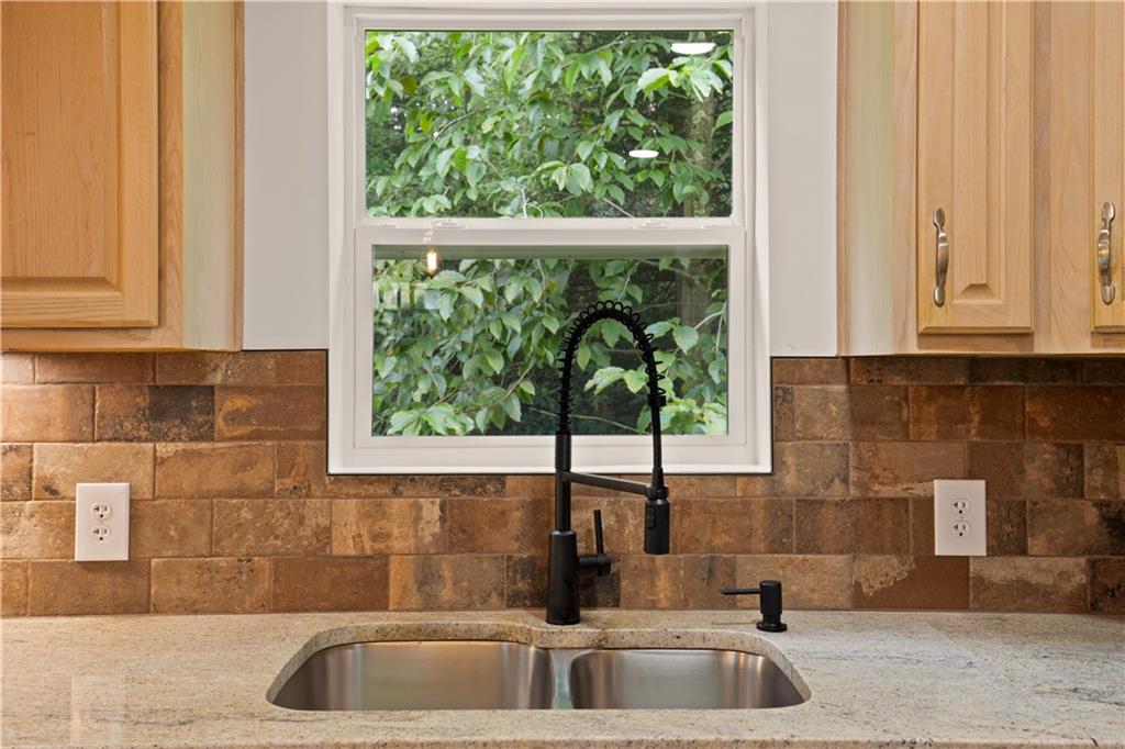 480 Freeman Falls Road Acme, PA 15610 - Photo 13 of 43 a kitchen with granite countertop a sink and a window