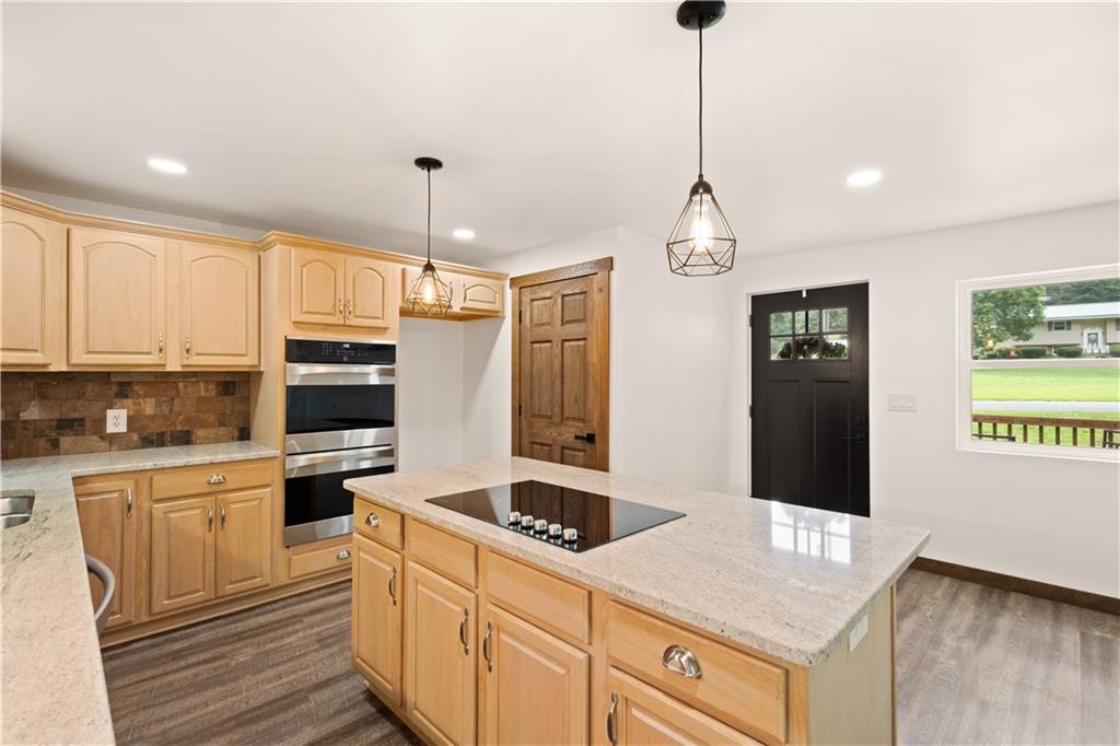 480 Freeman Falls Road Acme, PA 15610 - Photo 14 of 43 a kitchen with granite countertop a sink stainless steel appliances and cabinets