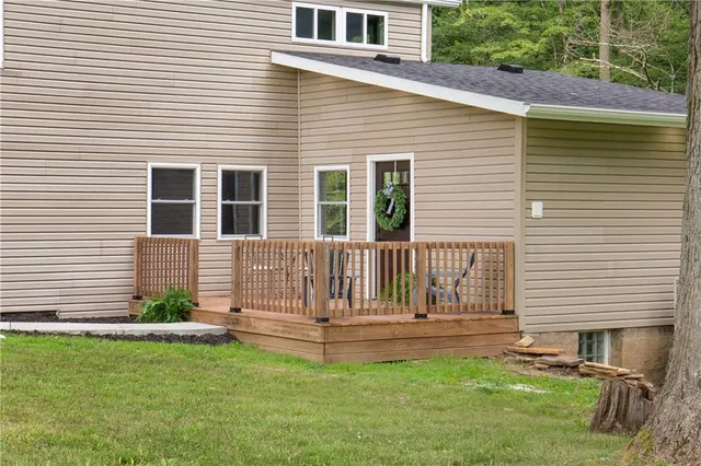 a view of a house with a backyard