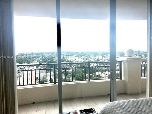 3232 Southwest 22nd Terrace, Unit 1303 Miami, FL 33145 - Photo 18 of 43 a view of a large window with a balcony