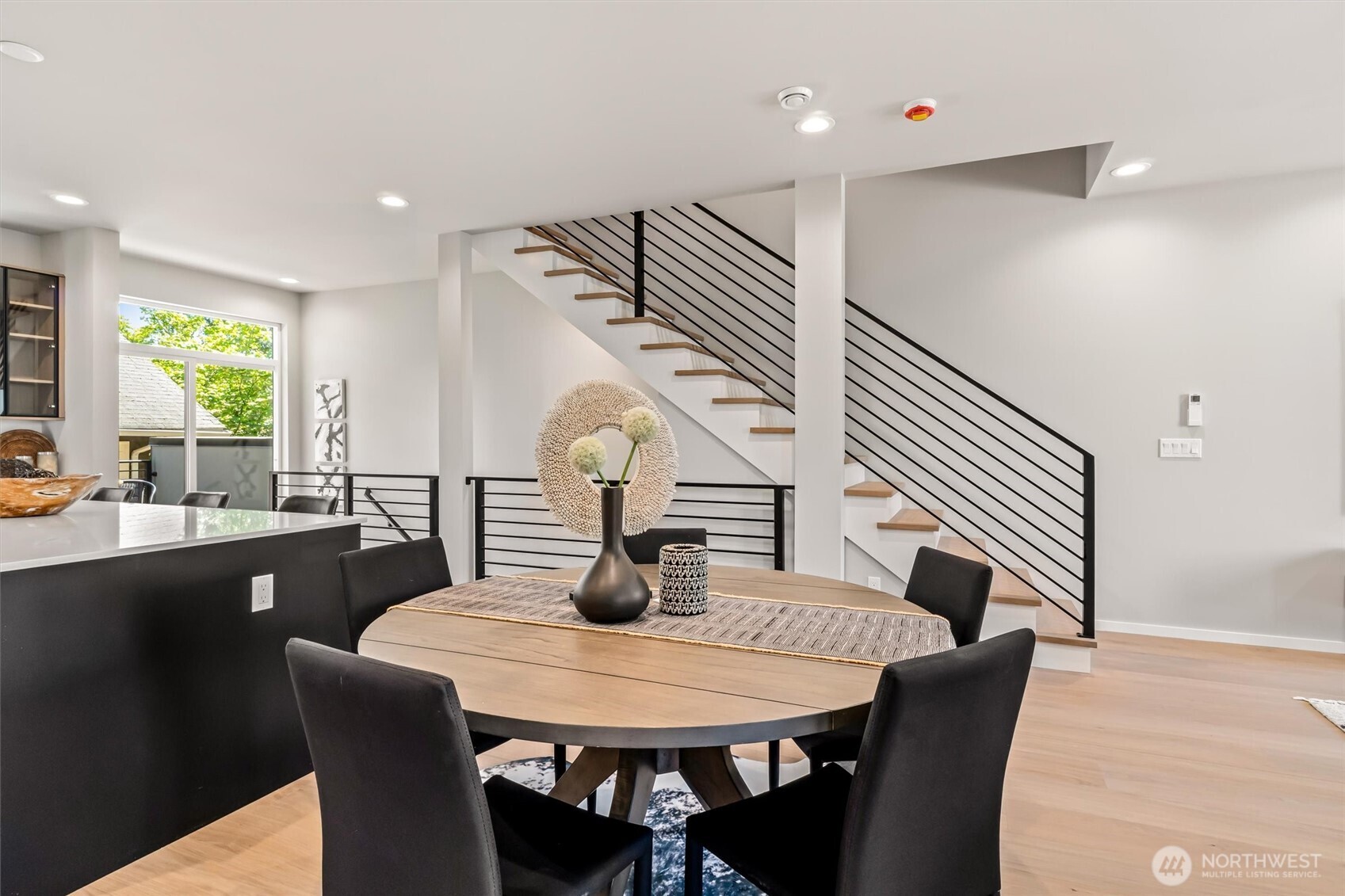 4460 Midvale Avenue North Seattle, WA 98103 - Photo 16 of 40 a view of a dining room with furniture and wooden floor