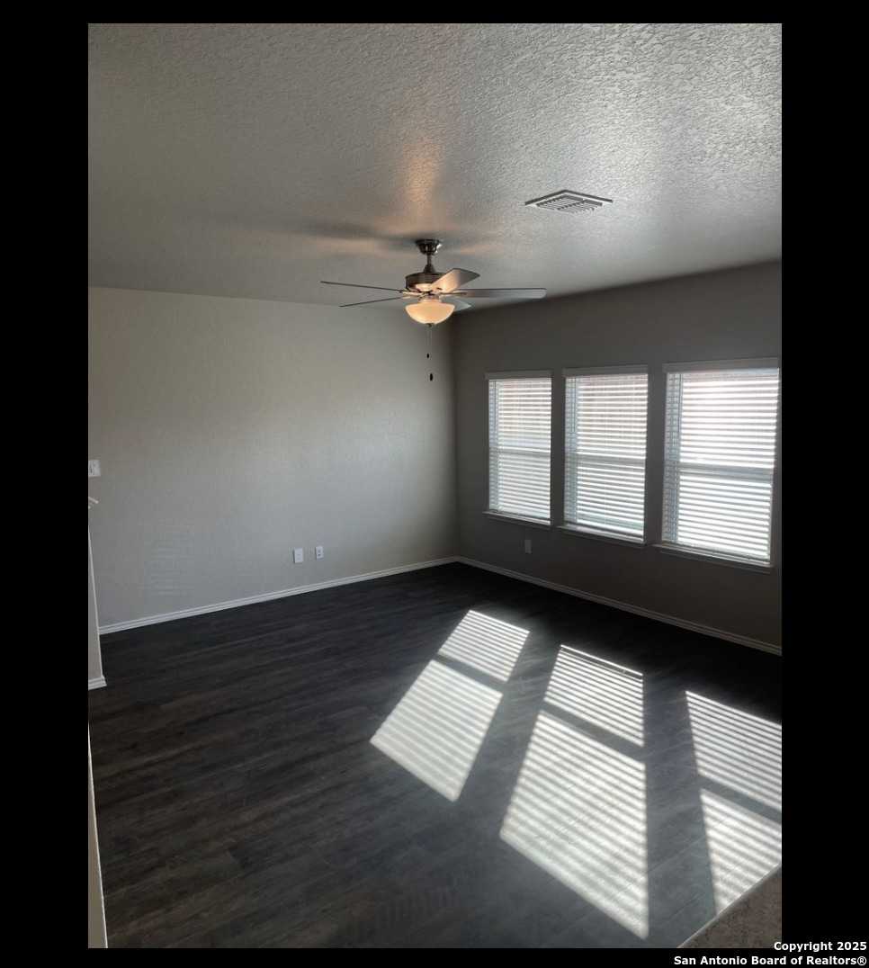 13121 Candace Way St. Hedwig, TX 78152 - Photo 3 of 13 a view of an empty room with a window