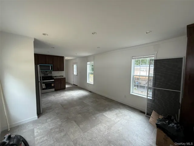 a view of empty room with windows