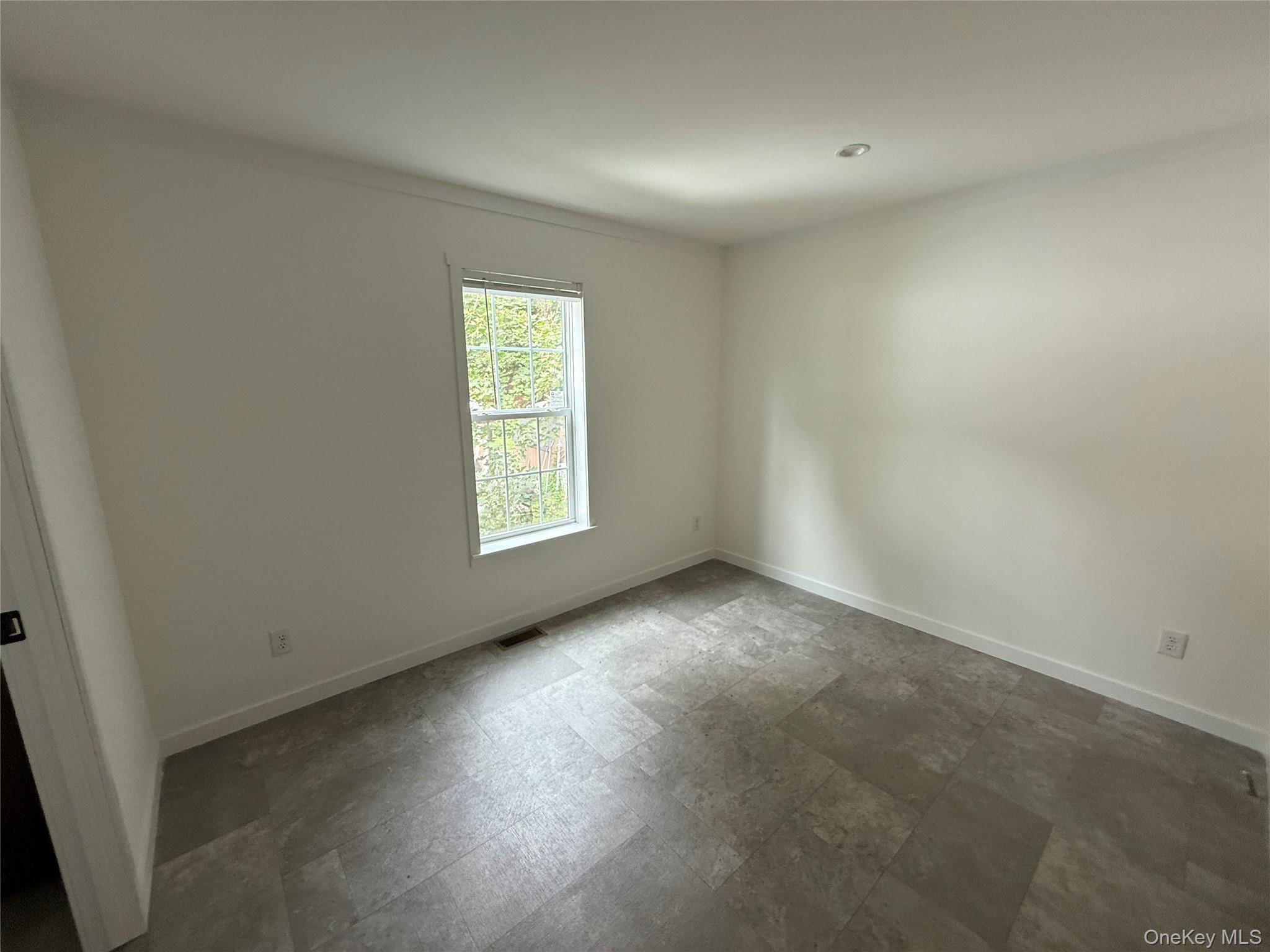 128 Forest Park Wallkill, NY 12589 - Photo 16 of 19 an empty room with a window