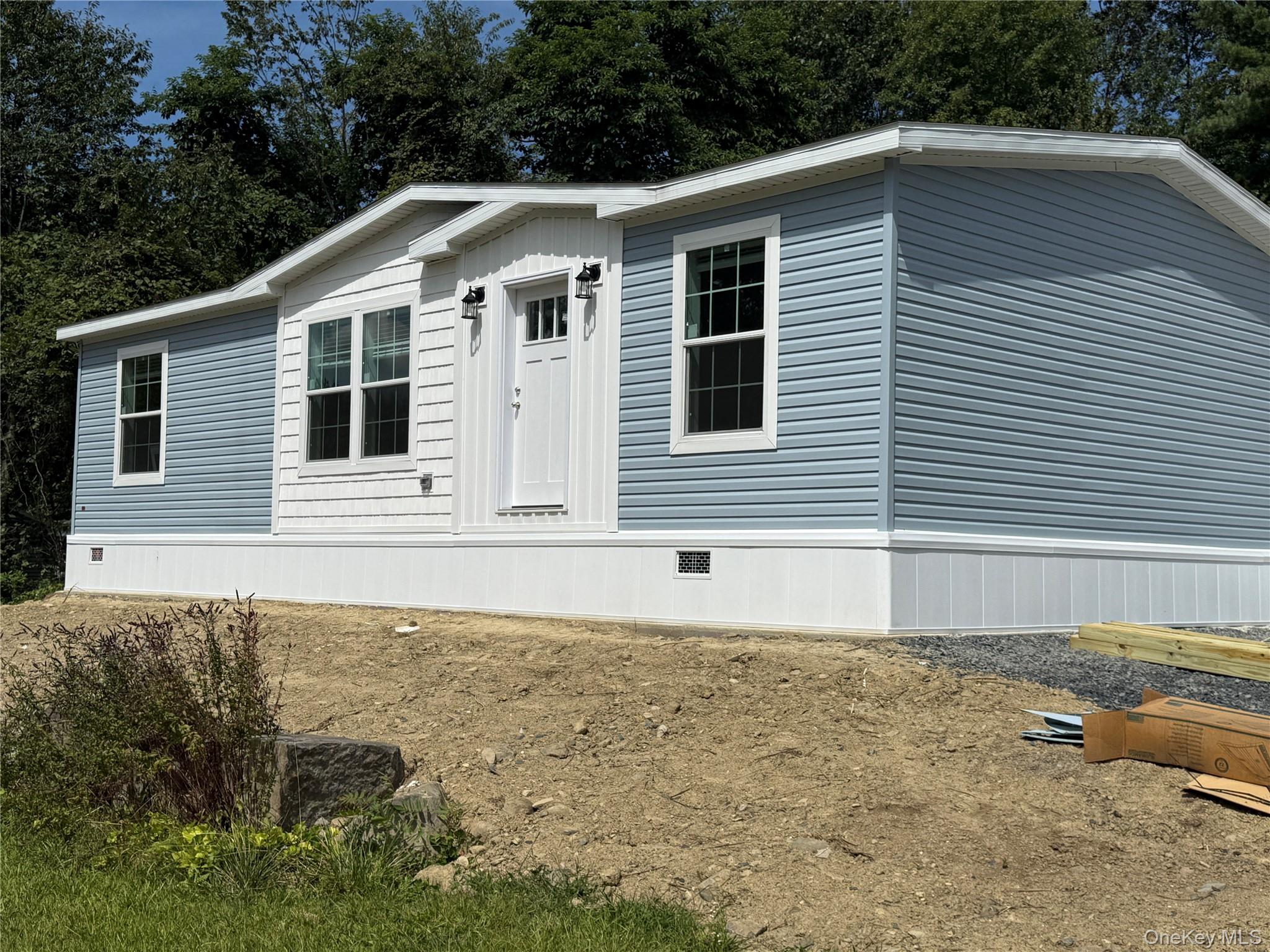 128 Forest Park Wallkill, NY 12589 - Photo 2 of 19 a front view of a house with a yard
